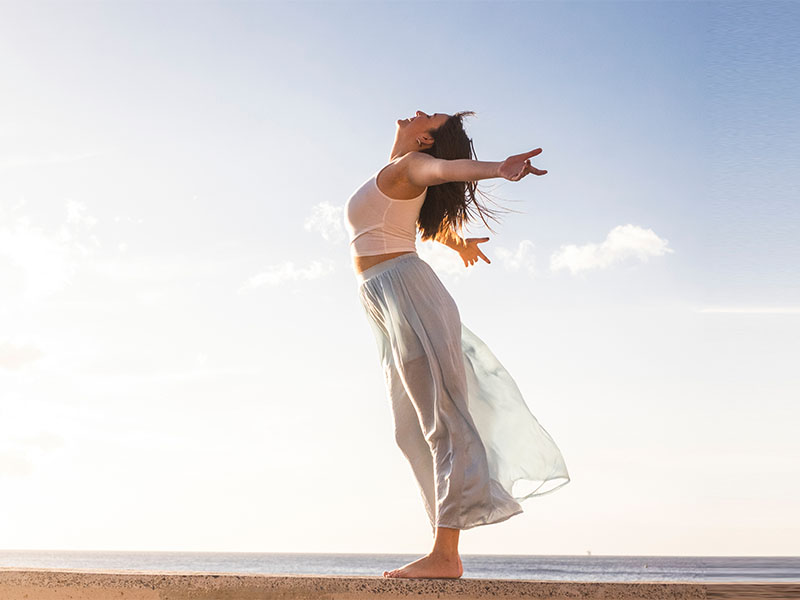 Freedom and empowerment female concept with young girl standing