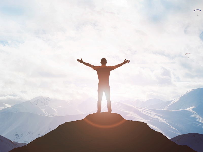 Male silhouette on sunrise background